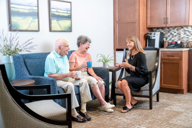 independent living marketing counselor meets with prospective residents at affordable retirement community