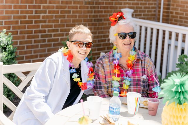 AL residents enjoy a tropical party at Bridgewater Retirement Community.