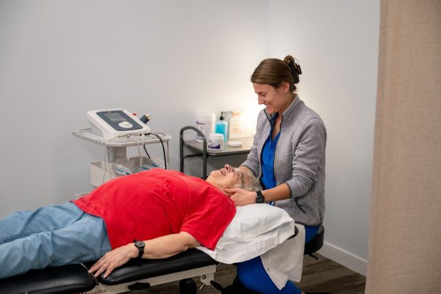 A team member performs physical therapy with a resident at Bridgewater Retirement Community